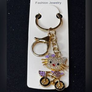 Mint BAG CHARM Sparkly Cat on Bicycle Keychain/Purse Charm Purple